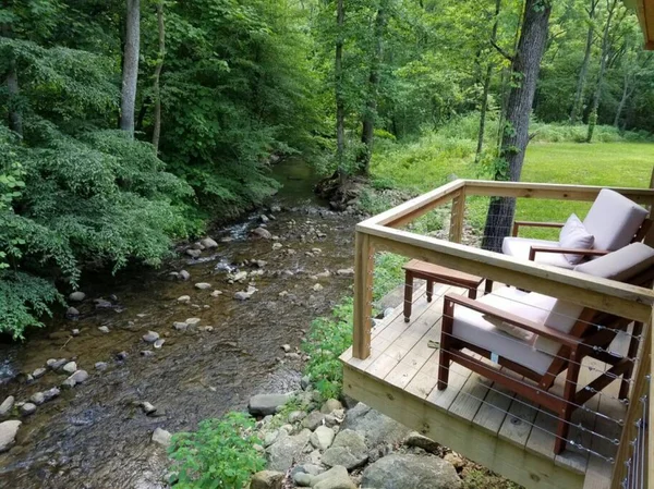 Log Cabin on the River cabin at White Lotus Eco Spa Retreat, Stanardsville, VA — photo 5 of 30